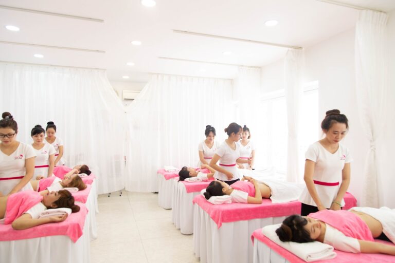 acupressure reflexology ancient massage room with pink and white theme