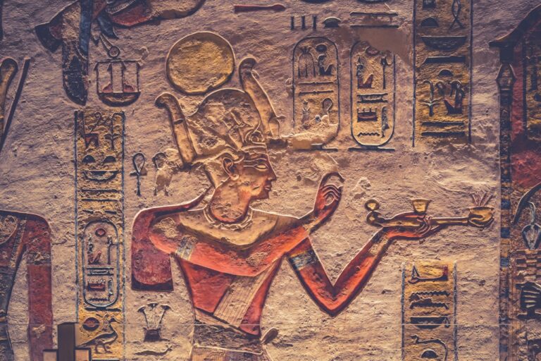 A painting of an egyptian god holding a cup