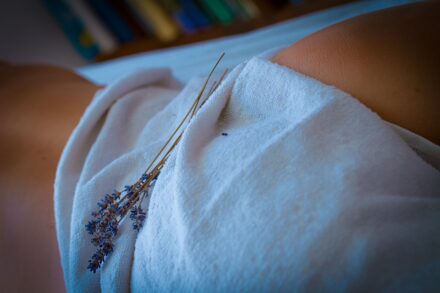 Acupuncture a close-up of a person's arm with a tattoo on it