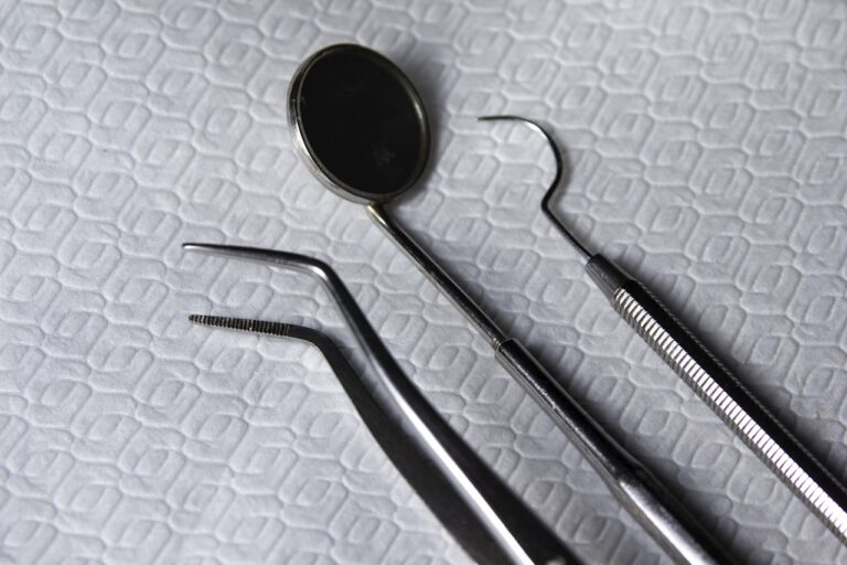 Acupuncture a pair of dental instruments sitting on top of a bed