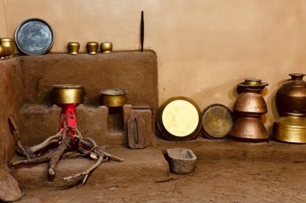 Ancient Medicinal Practices a group of pots sitting on top of a stone floor