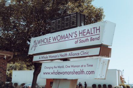 AO Scan a sign with a tree in the background