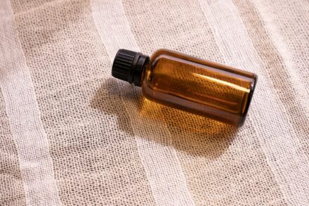 Aromatherapy Oils Guide 8 a bottle of essential oil sitting on a cloth