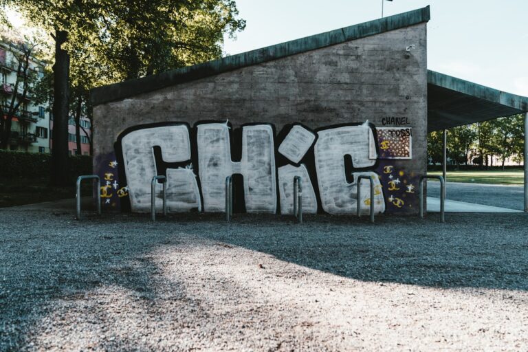 black and white concrete wall with graffiti
