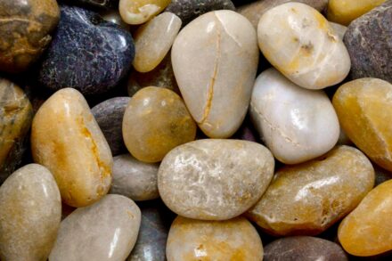 Colorful chakra healing stones usage arranged on body energy centers