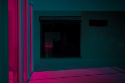 a room with a pink light in the middle of it