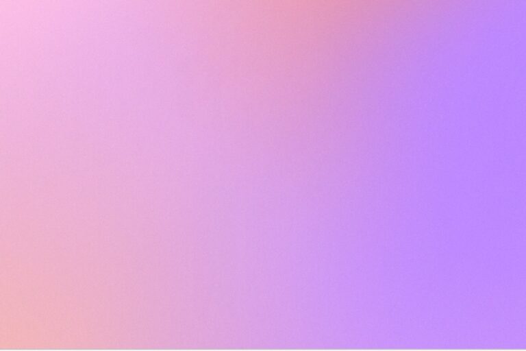 a blurry image of a pink and purple background