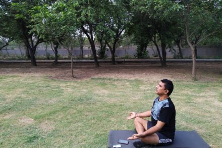 Ayurvedic Daily Routines: Dinacharya: 2 man in blue crew neck t-shirt sitting on gray wooden bench during daytime