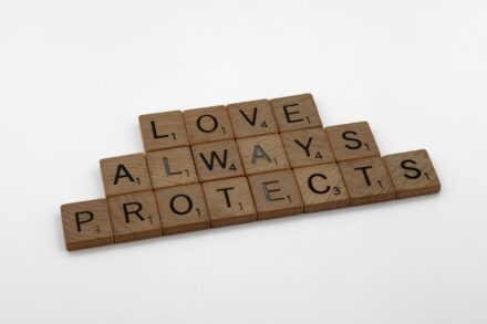 scrabble tiles spelling love, always, protect, and protect