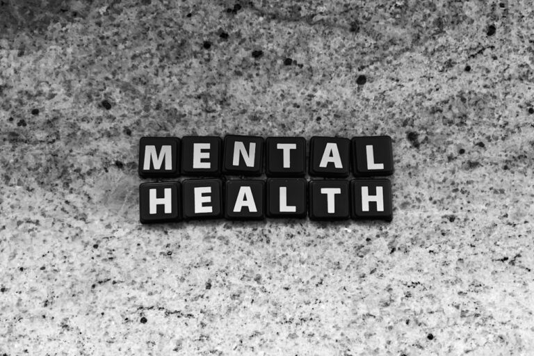 a black and white photo of the word mental health