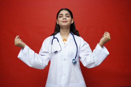 a doctor with her hands up