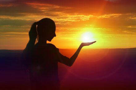 Explaining Energy Healing Concepts: What Healing? 10 silhouette of woman raising her right hand during sunset