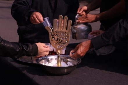 Herbal Medicine person holding stainless steel container