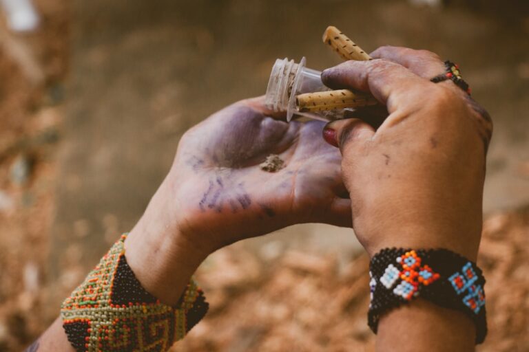 Herbal Medicine person holding clear glass tube