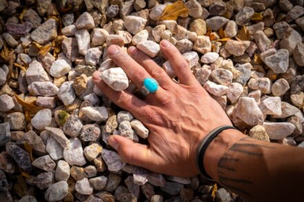Crystal Healing A person's hand on a pile of rocks