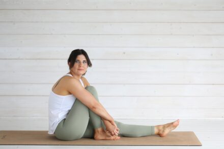 Gentle Yoga Practices wear world pilates Woman in yoga pose on mat against white wall