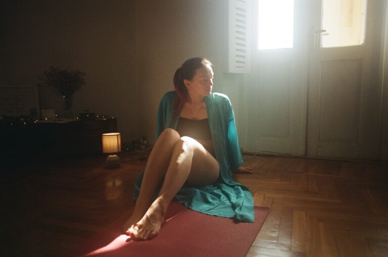 Person practicing guided meditation for healing in a calm, peaceful setting