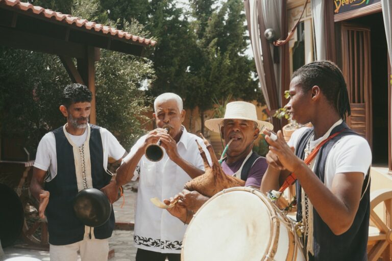 Group of men playing musical instruments outdoors