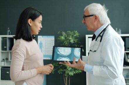 Health Insight Scan: Quickly Insights 6 Doctor shows patient medical scan on tablet.