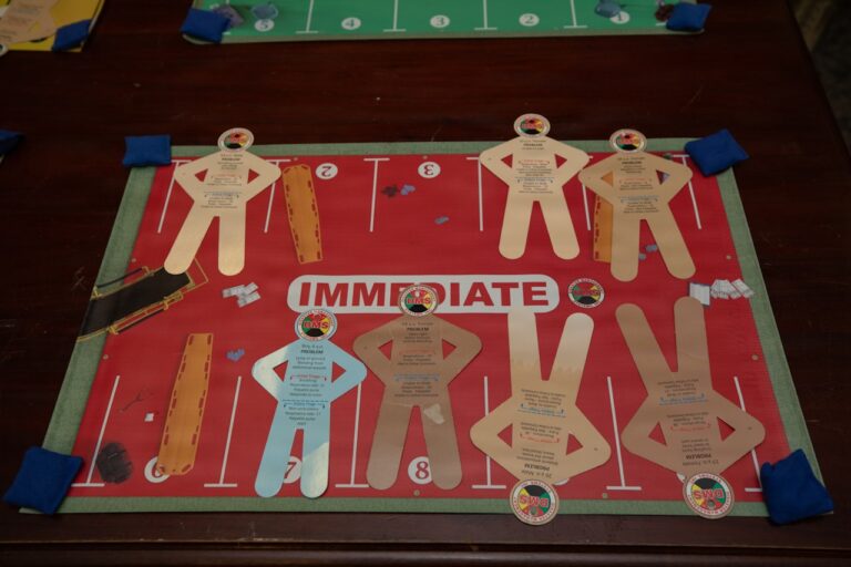 Board game with paper football players on field