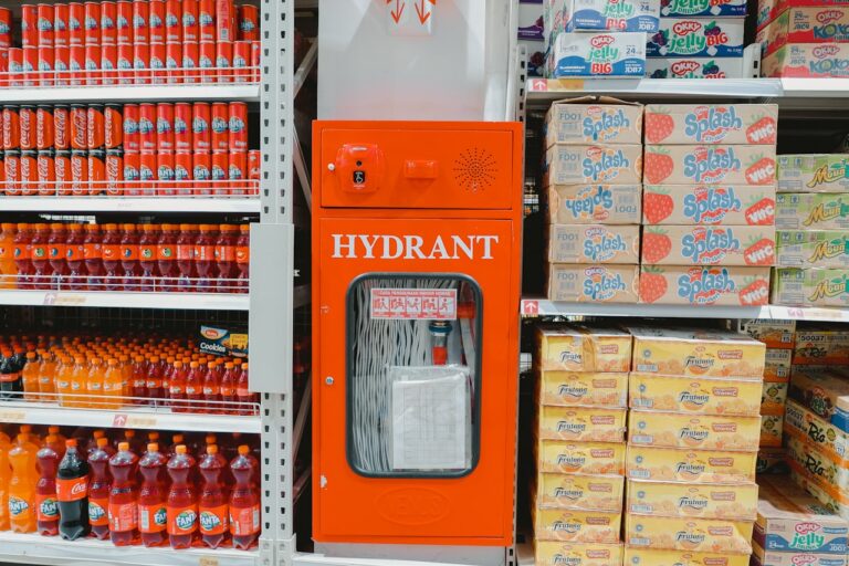 an orange hydrant machine in a grocery store