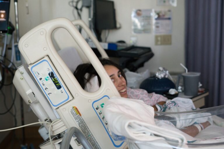 Hyperbaric Chamber Young woman smiling in hospital bed