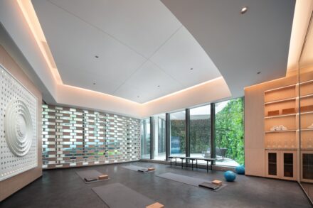 Listings Modern yoga studio with large windows and natural light.