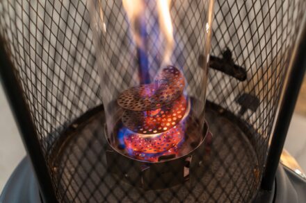 a close up of a stove with a fire inside of it