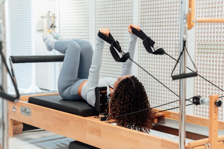 Physical Healing a woman is doing exercises on a rowing machine
