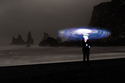 physical healing post surgery quantum pseudoscience a man standing on top of a beach under a light painting