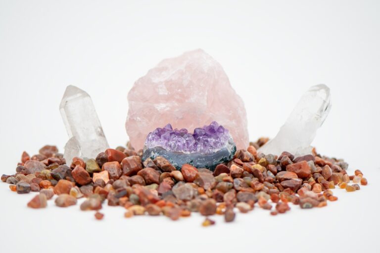 A pile of rocks and crystals on a white background