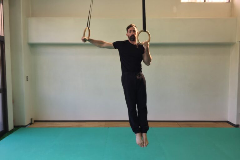 a man hanging upside down on a rope