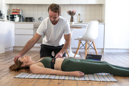 a woman laying on the floor in front of a man
