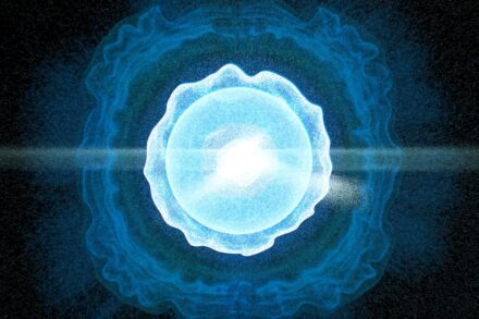 A blue ball of light in the middle of a black background