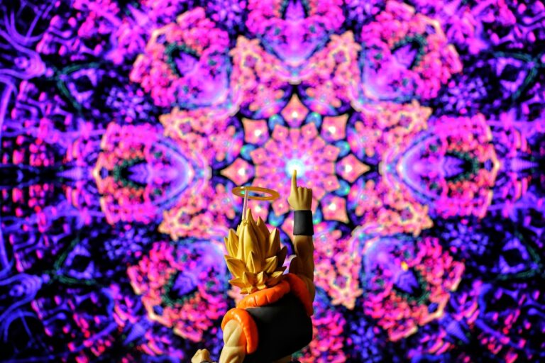 A figure points at a vibrant, kaleidoscopic background.