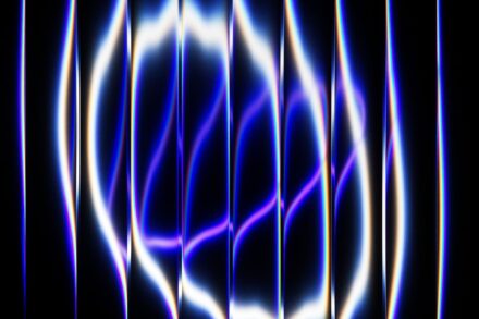 Abstract glowing blue and white light patterns