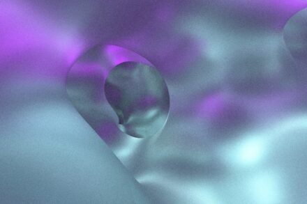 A blurry image of a purple and white background