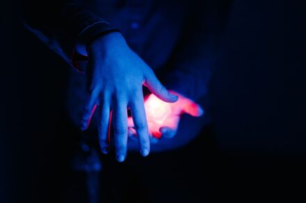 Quantum Healing & Techniques red light on human palm