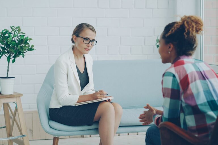 Quantum Healing & Techniques Two women talking in a therapy session