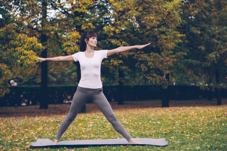 Quantum Healing & Techniques Woman practicing yoga in a park