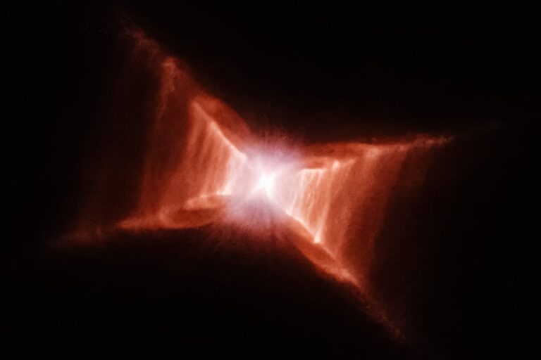 a red and white object in the dark