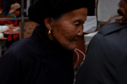 Reiki Healing woman in black hoodie wearing gold earring