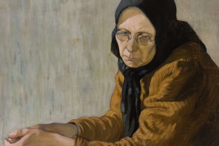 Reiki Healing An elderly woman in glasses and headscarf looks thoughtfully.