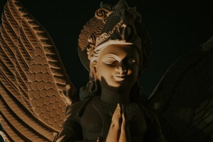 An angelic statue with wings and a headdress.