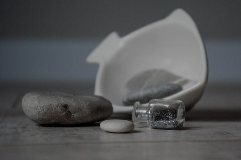 white ceramic heart shaped bowl on brown wooden table