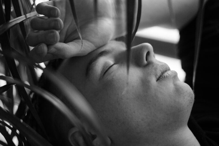 rTMS (Repetitive Transcranial Magnetic Stimulation) grayscale photo of womans face