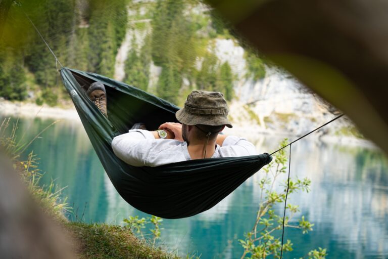 Salt Therapy a man sitting in a hammock with a view of a lake