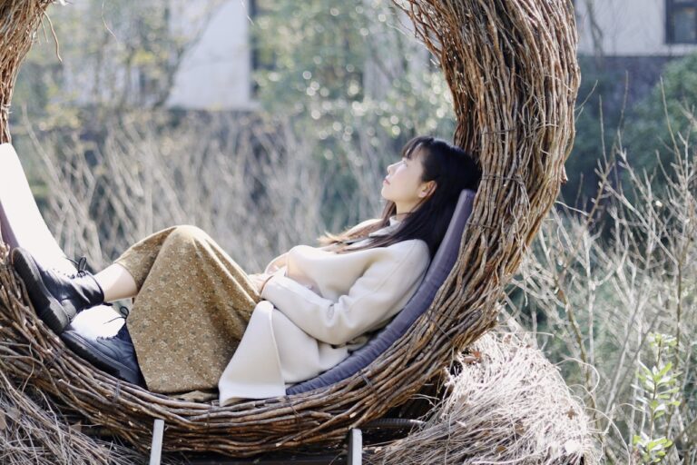 Salt Therapy girl in white dress on brown woven basket