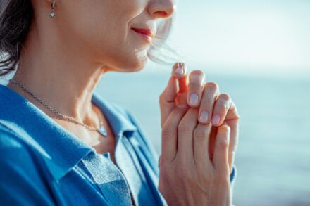 Aromatherapy a woman holding her hands together in prayer