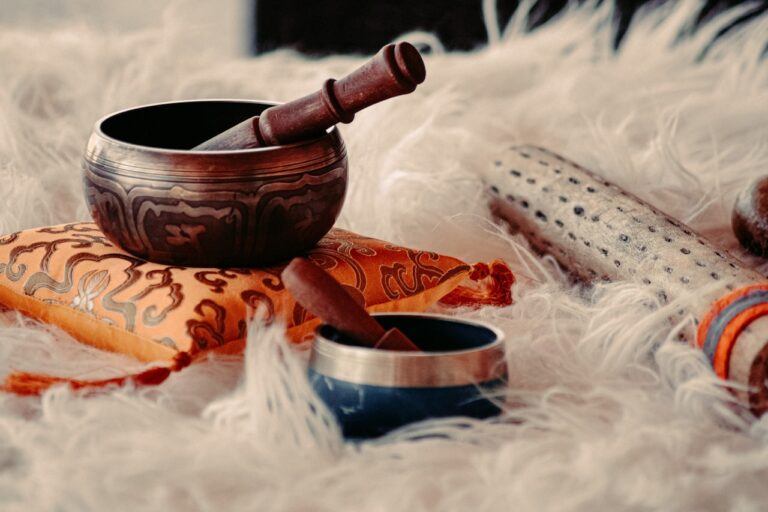 brown wooden mortar and pestle on white textile